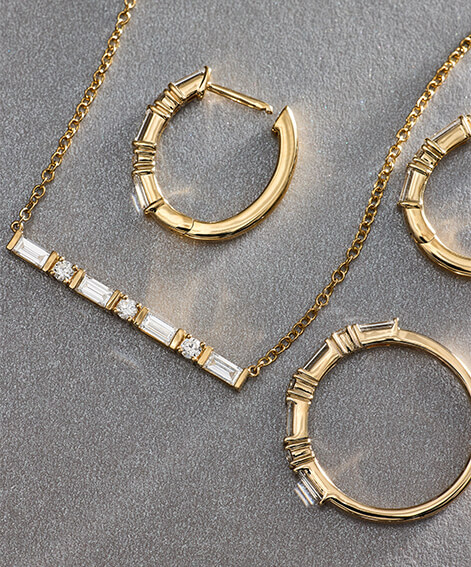 Personalized gemstone jewelry in yellow gold.